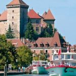 Boats on Lake Annecy with the castle overlooking the old town